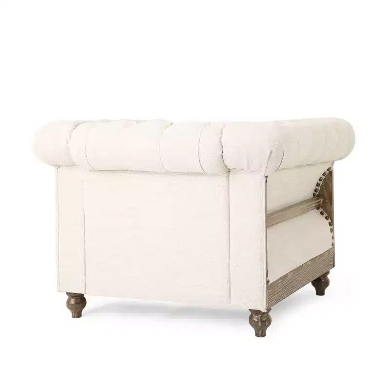 Fauteuil club Chesterfield en tissu capitonné avec clous décoratifs