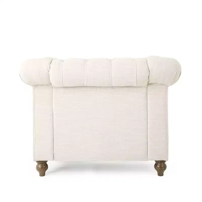 Fauteuil club Chesterfield en tissu capitonné avec clous décoratifs